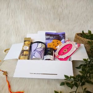 "Rakshabandhan Hamper Box For Brother"-Rice husk Pleasant purple sipper along with lid,Rakhi,Ferraro rocher,Max protein  cookie,Carnival dry fruits For Festive gift