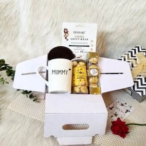 "Goodies for Mommies"-One ivory white unbreakable tall mug,one sustainable coster,ferrero rocher,cockies,coffee sheet mask,a greeting card.  For Festive gift