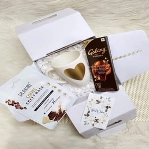 "To You, From Me"-One  Gold hearted unbreakable coffee mug,Galaxy dark chocolate bar,Coffee sheet mask from Dr. Reshel ,A best wishes card For Festive gift
