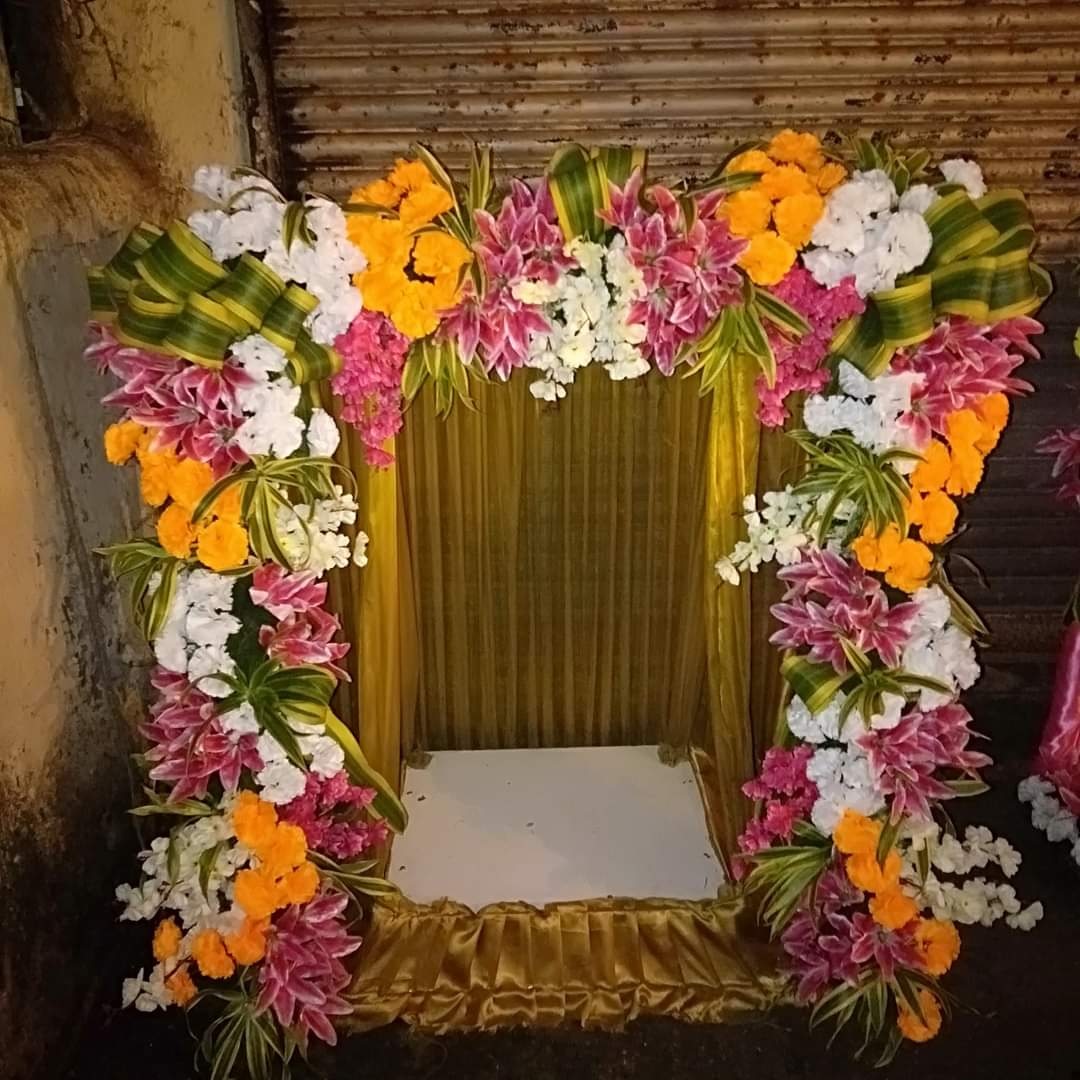 Traditional Pink & Yellow Floral Ganpati Decoration